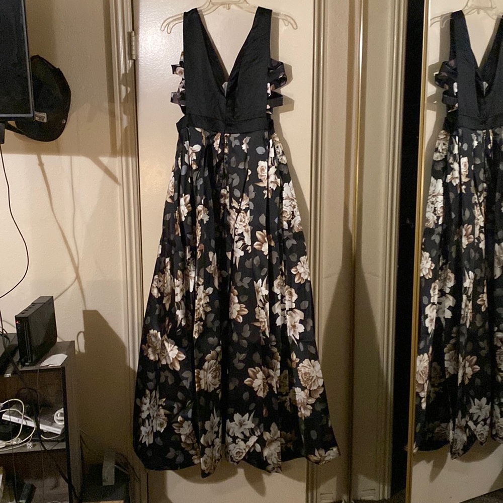 Black and floral long dress. Brand new. Never used.